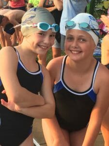 2 Young Smiling Girls in Swimming Suits